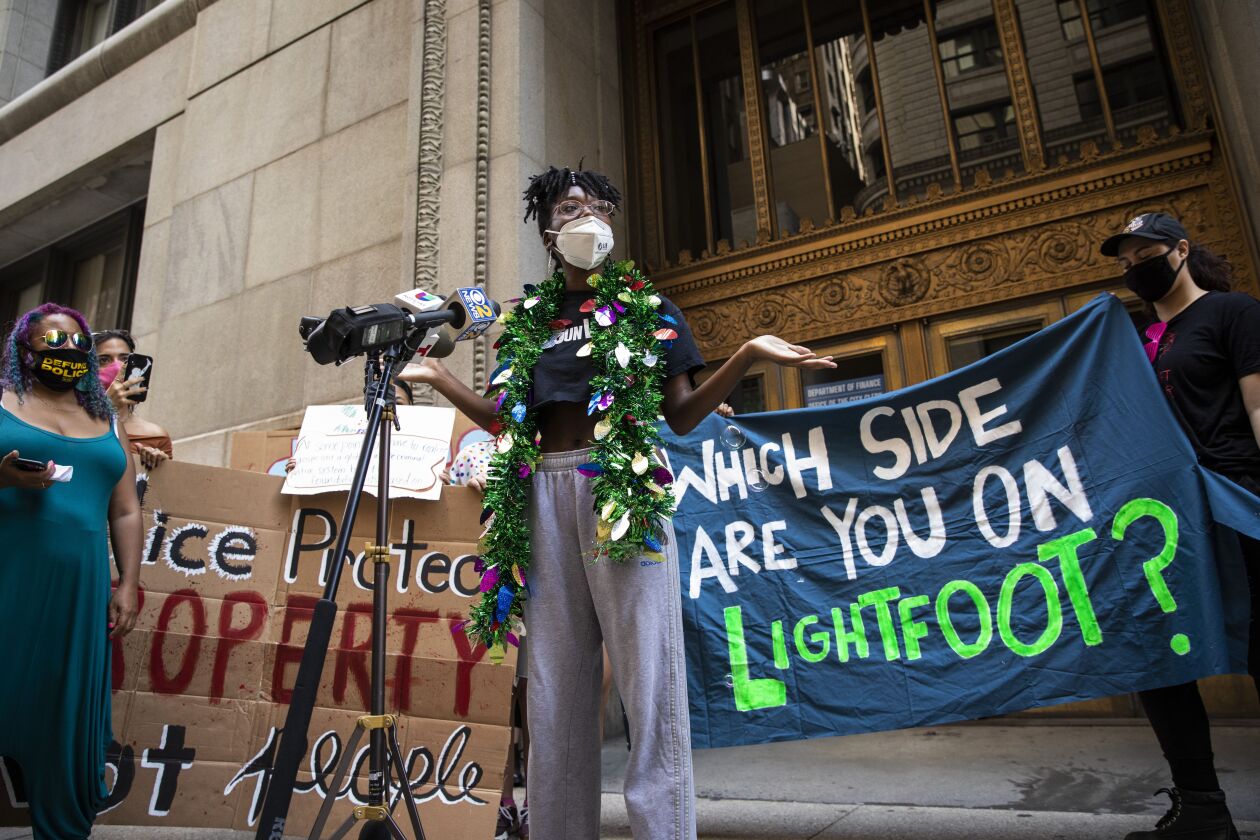 Community activist Destiny Harris speaks during a protest outside City Hall in the Loop to call for the city to defund the Chicago Police Department, Tuesday afternoon, Aug. 18, 2020. | Ashlee Rezin Garcia/Sun-Times